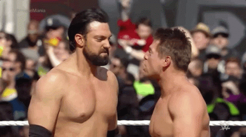 Two Men Wrestling in Ring