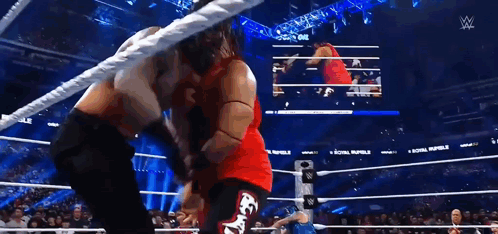 Two Men Wrestling In Ring GIF