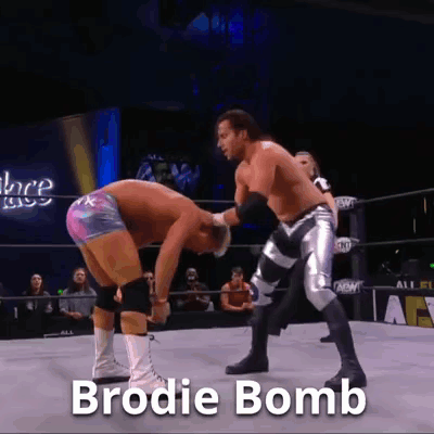 Two Men Wrestling In Ring With Brodie Bomb Text GIF