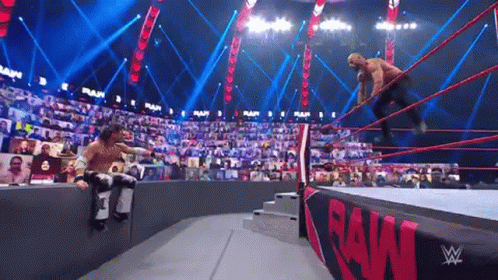 Two Men Wrestling In Ring With Crowd GIF