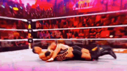 Two Men Wrestling In Ring With Crowd GIF