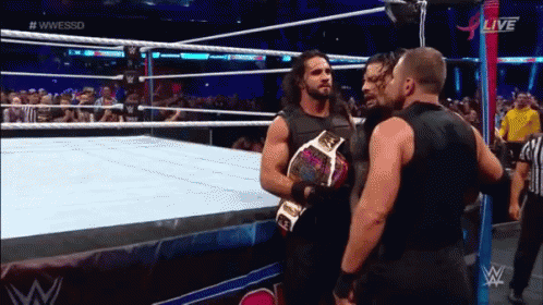 Two Men Wrestling In Ring With Crowd GIF