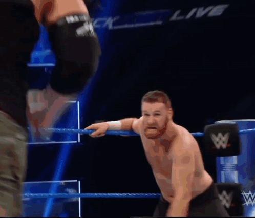 Two Men Wrestling In Ring With Live GIF