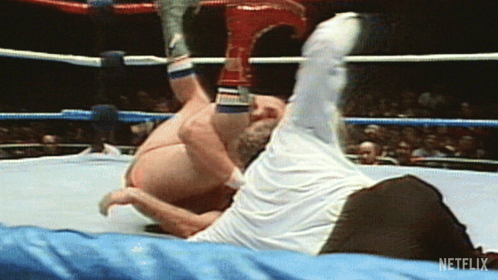Two Men Wrestling in Ring with Netflix