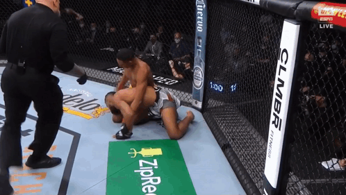 Two Men Wrestling In Ring With Zipre Sign GIF