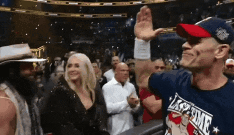 Two Men Wrestling in Stadium One in KO Shirt