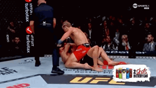 Two Men Wrestling in UFC Ring with 2 Shots in Every Can