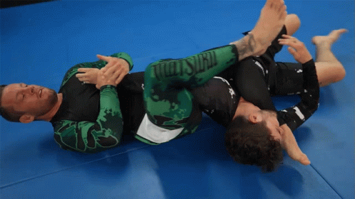 Two Men Wrestling on Mat