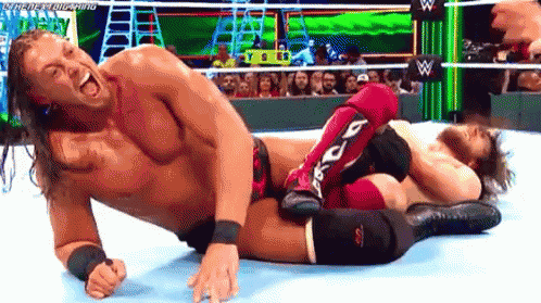 Two Men Wrestling, One In Red Knee Pads GIF