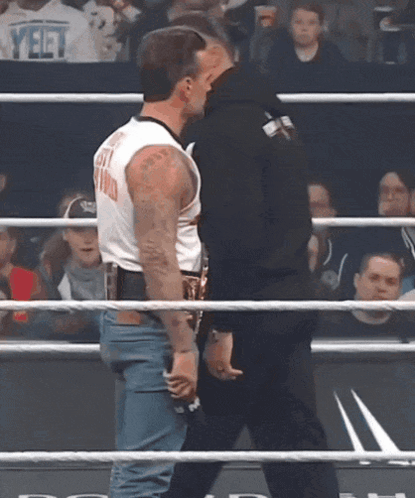 Two Men Wrestling One Wearing Yeet Shirt