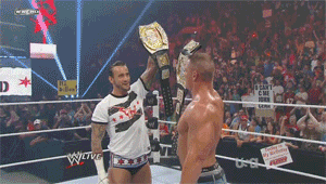 Two Men Wrestling With I Can't Come Back Sign