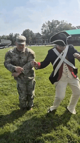 Two Military Men Holding Hands
