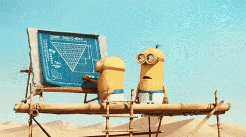 Two Minions on Scaffolding Looking at Blueprint in Desert