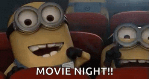 Two Minions Watching Movie In Theater GIF