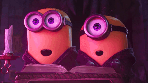two minions with purple eyes are reading a book together