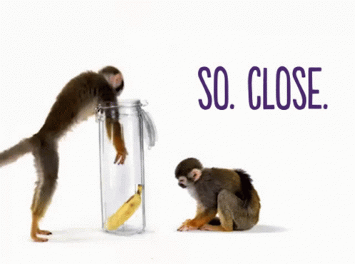 Two Monkeys Are Standing Next To A Jar With A Banana In It And The Words So Close Behind Them GIF