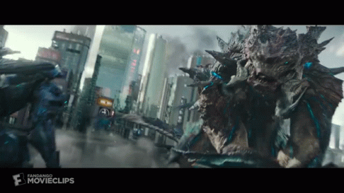 Two Monsters Are Fighting In A City In A Movie Clip . GIF