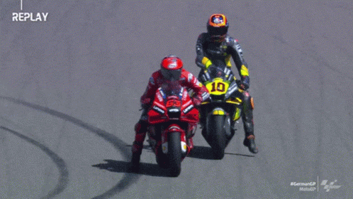 Two Motorcycle Racers Yellow Bike Number 10