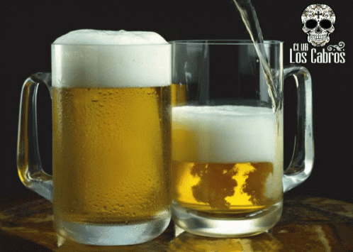 Two Mugs Of Beer With Club Los Cabros Written On The Front GIF
