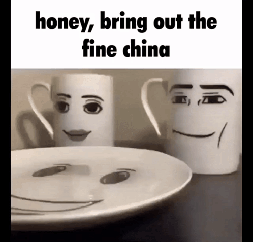 Two Mugs With Faces Drawn On Them Are Sitting Next To A Plate GIF