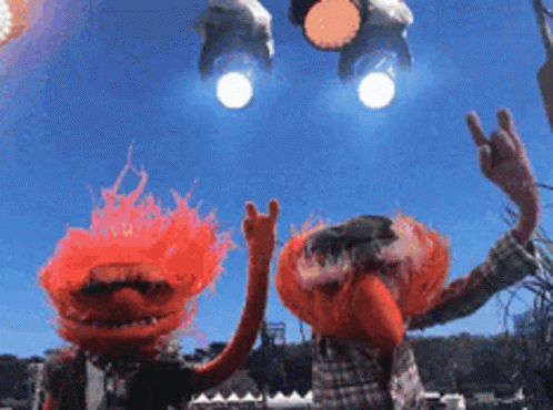 Two Muppets with Red Hair Giving Peace Sign