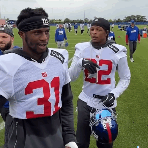 Two New York Giants Football Players Are Talking GIF