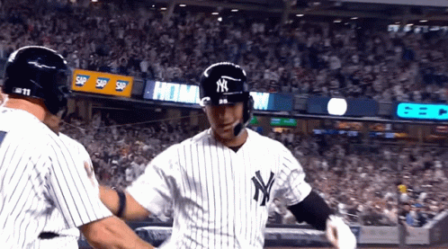 Two New York Yankees Baseball Players Are Hugging GIF