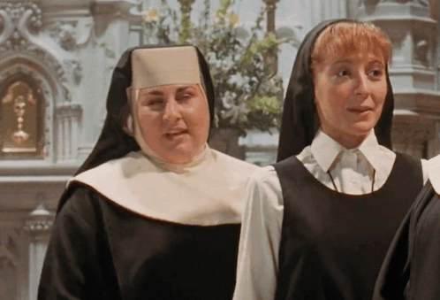 Two Nuns in Front of Church