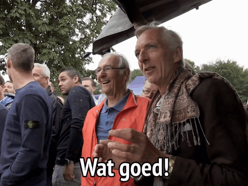 Two Older Men Orange Jacket Wat Goed