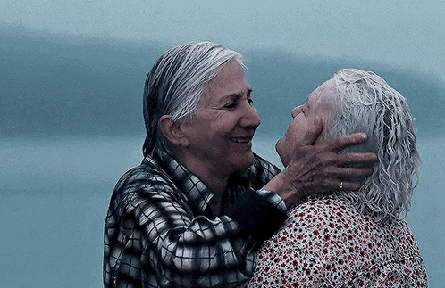 Two Older Women Are Hugging Each Other And Smiling . GIF