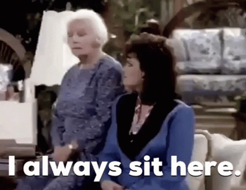 Two Older Women Are Sitting On A Couch And One Of Them Is Saying `` I Always Sit Here . '' GIF