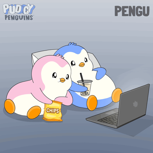two penguins sitting next to each other with a bag of chips in front of a laptop