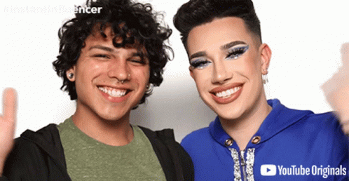 Two People Are Posing For A Picture And One Of Them Is Wearing A Youtube Originals Logo GIF
