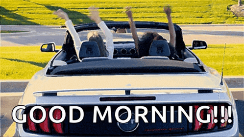 Two People Are Sitting In A Convertible Car With Their Arms In The Air And The Words Good Morning Written On The Back . GIF