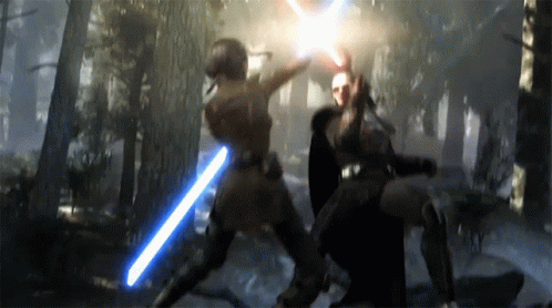 Two People Fighting With Lightsabers In A Forest GIF