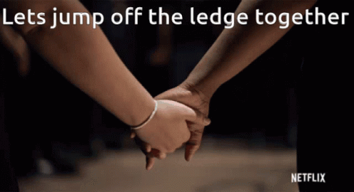 Two People Holding Hands Let Jump Off Ledge