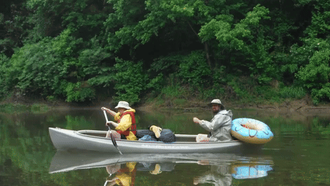 Two People In A Canoe That Says Kayak.com GIF
