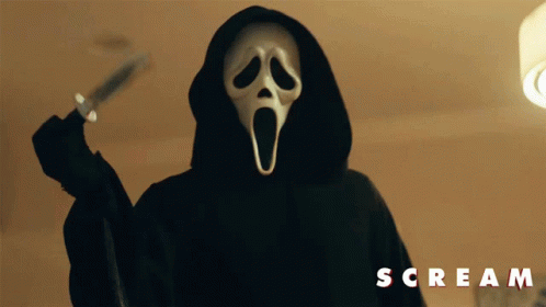 Two People in Scream Masks in Dark Room