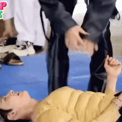 Two People On Blue Mat Hand Over Head GIF