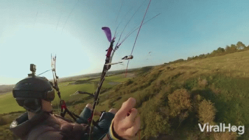 Two People Paragliding GIF