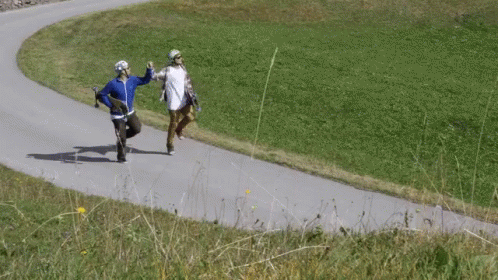Two People Running on Road