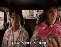 Two People Sitting in Car Back Seat With Apple