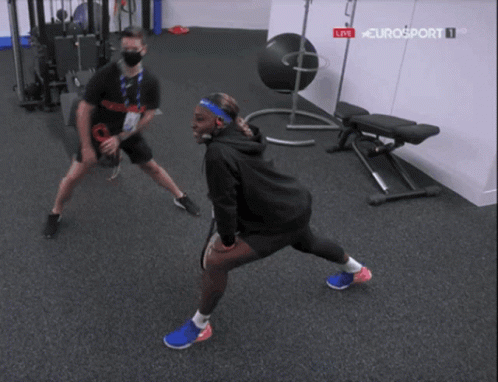 Two People Stretching In Gym GIF