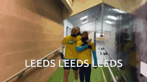Two People Walking Down Hallway Leeds Leeds Leeds GIF