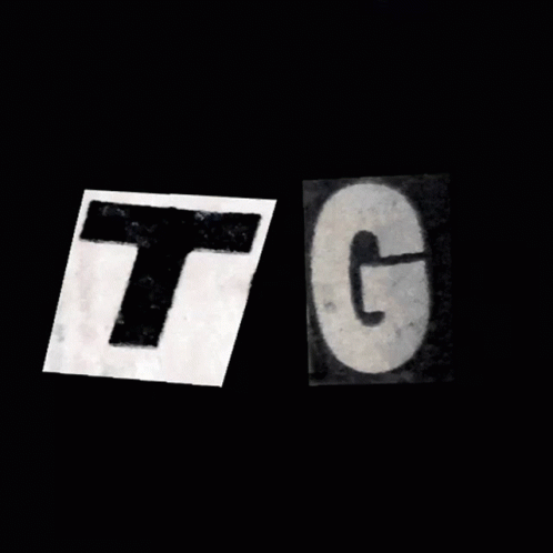 Two Pieces Of Paper With The Letters T And G On Them GIF