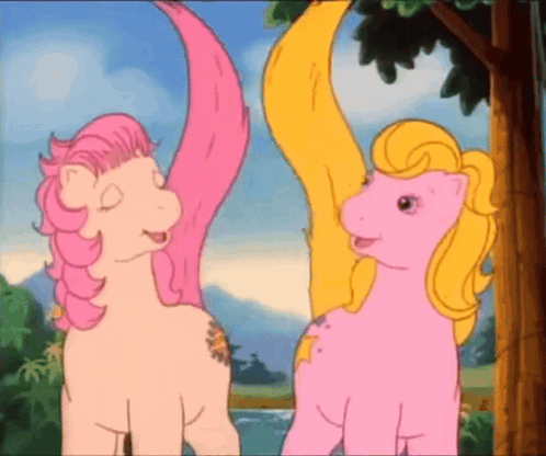 Two Pink Ponies Standing Together GIF