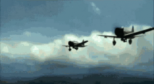 Two Planes Flying In Cloudy Sky GIF