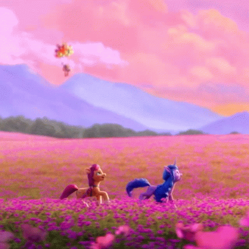 Two Ponies Are Walking Through A Field Of Purple Flowers . GIF