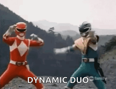 Two Power Rangers Are Standing Next To Each Other In A Dynamic Duo Pose . GIF