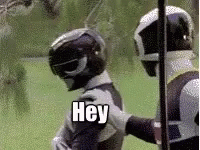 Two Power Rangers Holding Other's Arm
